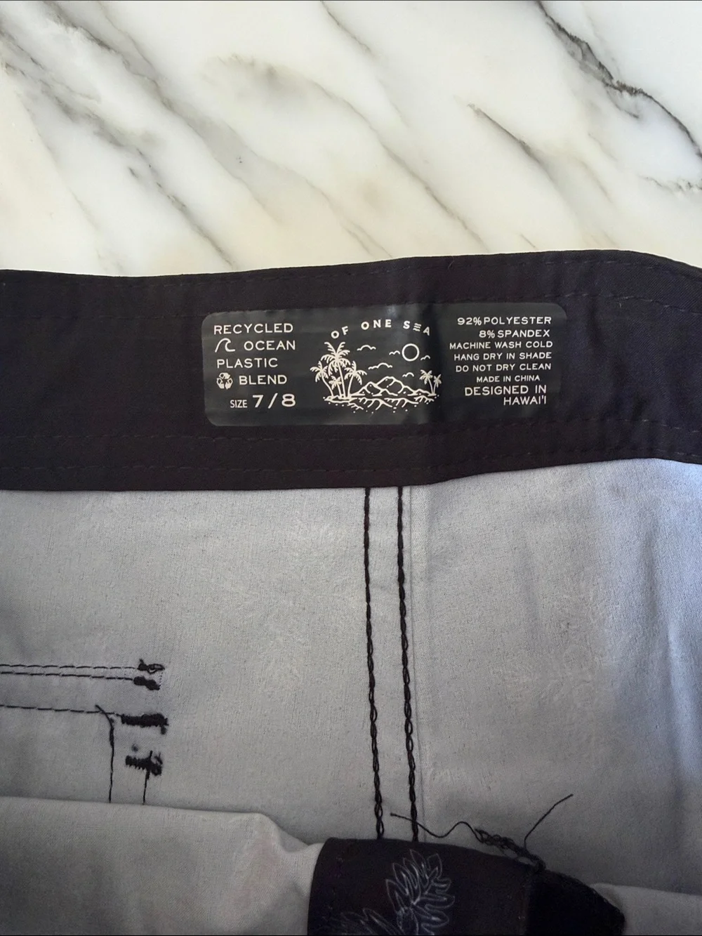 Boys one of sea black swim trunks 7/8 new